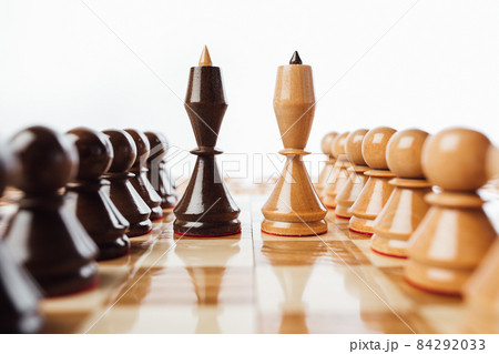 wooden chess pieces queens on the chessboard, close-up view 84292033