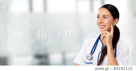 Beautiful woman doctor on medical background Beautiful woman doctor on medical background 84292115