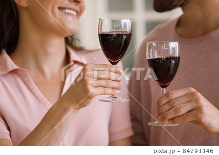 Close up happy loving couple clinking glasses of wine. 84293346