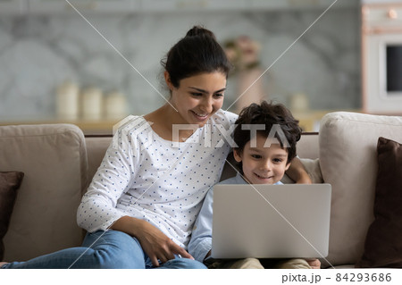 Happy Indian little son and loving mom enjoying leisure Happy Indian little son and loving mom enjoying leisure 84293686