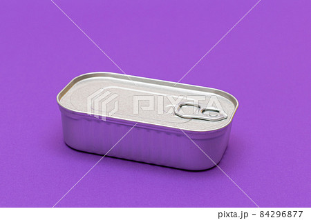 Unopened Tin Can with Blank Edge on Violet Background 84296877