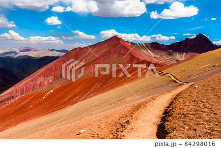 Hiking trail across the Red Valley at Vinicunca in Peru Hiking trail across the Red Valley at Vinicunca in Peru 84298016