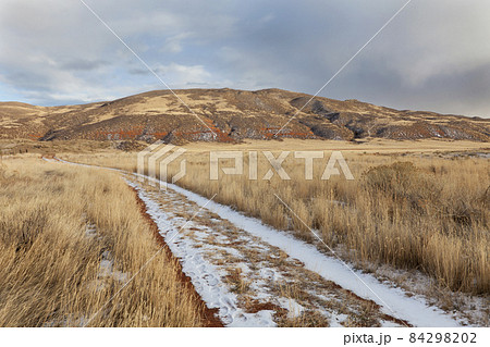 ranch road in a mountain valley 84298202