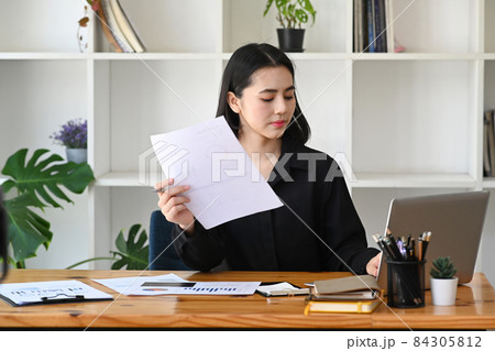 Young asian woman entrepreneur working with laptop computer. 84305812