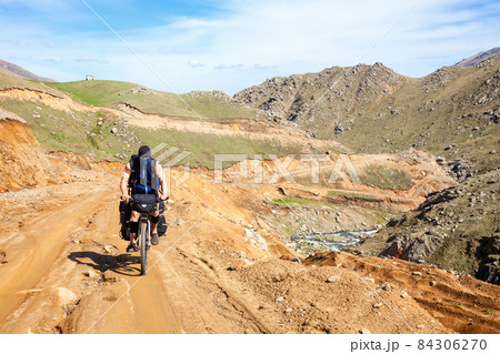 Traveling cyclist in Pontic Alps 84306270
