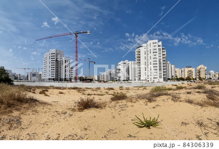 City construction among desert dunes.  84306339
