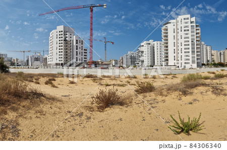 City construction among desert dunes. 84306340