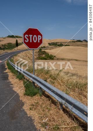 Stop road sign on hill of Tuscany Italy Stop road sign on hill of Tuscany Italy 84306497