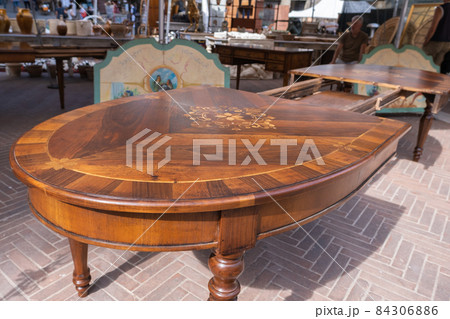 Furniture on flea market in Arrezo, antique inlaid table Furniture on flea market in Arrezo, antique inlaid table 84306886
