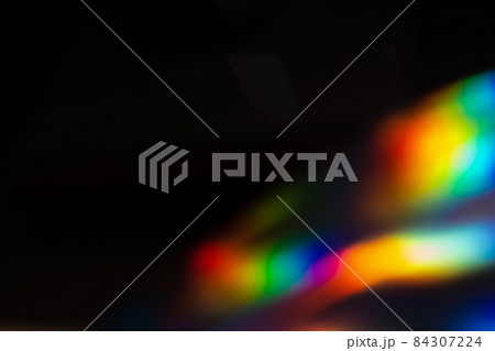 colorful rainbow crystal light leaks on black background 84307224