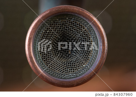 Copper tap with faucet aerator strainer close-up Copper tap with faucet aerator strainer close-up 84307960