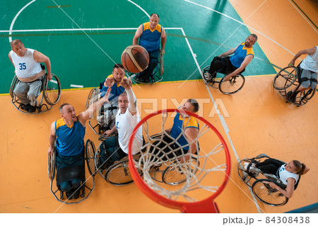 a photo of basketball teams with disabilities with the selector in the big hall before the start of the basketball game 84308438