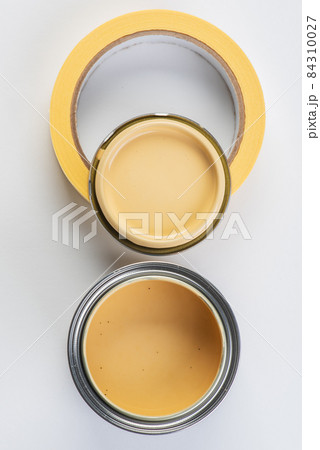 Opened paint can and painters tape top view Opened paint can and painters tape top view 84310027