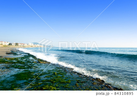 Mediterranean sea coast of the beach, stony sea and waves splashing Mediterranean sea coast of the beach, stony sea and waves splashing 84310895