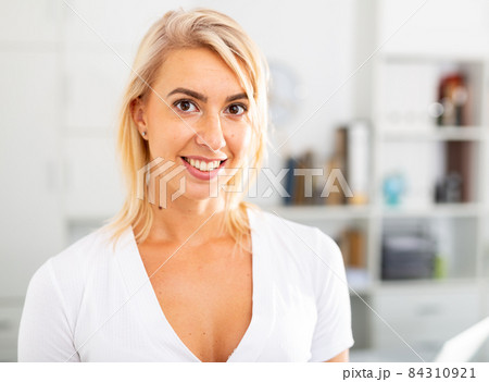 Portrait of positive business woman in the office 84310921