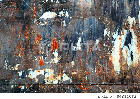 Rusty colored metal texture with cracked paint, grunge background Rusty colored metal texture with cracked paint, grunge background 84311082