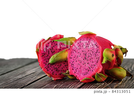 Two halves of dragon fruit on planks Two halves of dragon fruit on planks 84313051