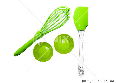 Set of green silicone cooking utensils isolated on white background 84314188