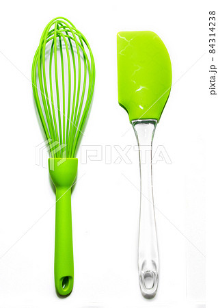 Set of green silicone culinary spatula and whisk Isolated on white background Set of green silicone culinary spatula and whisk Isolated on white background 84314238