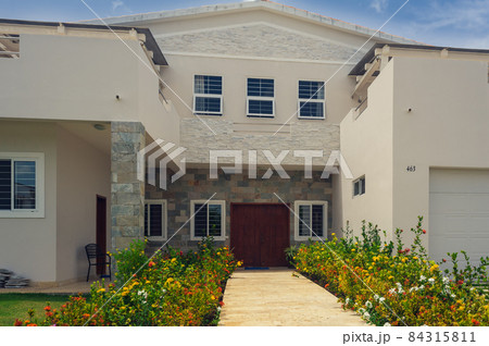 Beautiful Luxurious villa with an own swimming pool in Dominican Republic. summer residence on luxury Caribbean resort and beautiful garden. Beautiful Luxurious villa with an own swimming pool in Dominican Republic. summer residence on luxury Caribbean resort and beautiful garden. 84315811