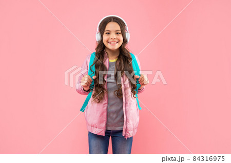 happy teen girl in headphones. listen to music. wireless headset device accessory happy teen girl in headphones. listen to music. wireless headset device accessory 84316975