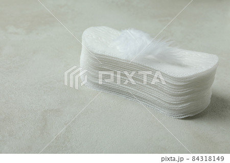 Stack of sanitary pads on white textured background Stack of sanitary pads on white textured background 84318149
