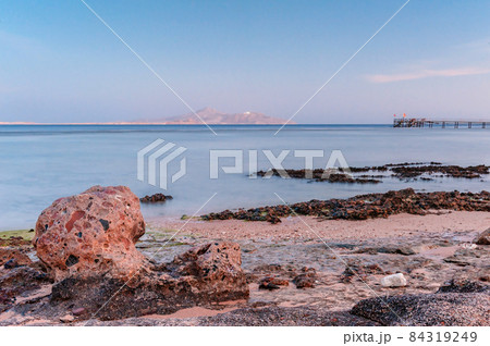 Soft sea ocean waves wash over golden sand background. Sunset, sunrise, sun Soft sea ocean waves wash over golden sand background. Sunset, sunrise, sun 84319249