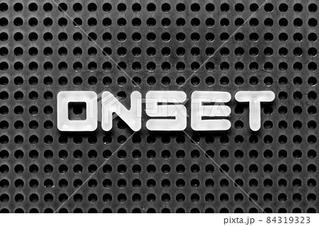 White alphabet letter in word onset on black pegboard background 84319323