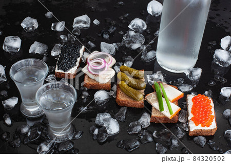 Vodka with pickled cucumber, black and red caviar, herring, lard, onion Vodka with pickled cucumber, black and red caviar, herring, lard, onion 84320502