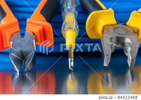 Electrical installation tool and cable wire close-up shiny workshop table Electrical installation tool and cable wire close-up shiny workshop table 84322468