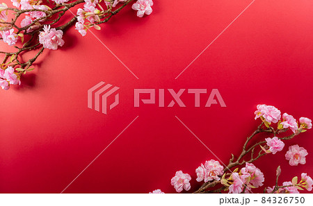 Chinese new year decorations made from plum blossom on a red background. A symbol for fortune, good luck, wealth, money flow. Chinese new year decorations made from plum blossom on a red background. A symbol for fortune, good luck, wealth, money flow. 84326750