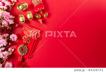 Chinese new year decorations made from red packet, orange and gold ingots or golden lump on a red background. Chinese characters FU in the article refer to fortune good luck, wealth, money flow. Chinese new year decorations made from red packet, orange and gold ingots or golden lump on a red background. Chinese characters FU in the article refer to fortune good luck, wealth, money flow. 84326751