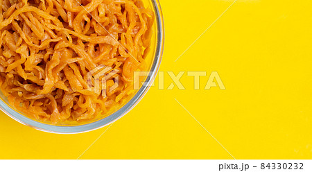 Pickle Turnip in plate in glass bowl on yellow background. 84330232
