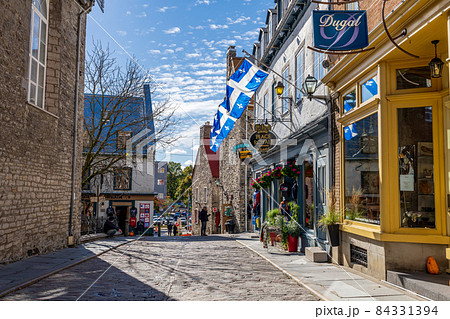 Quebec, Canada - October 20 2021 : Quebec City Old Town street view in autumn season. Place Royale. Rue Notre-Dame. 84331394
