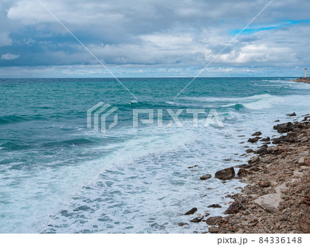 view of ocean waves and a fantastic rocky shore 84336148