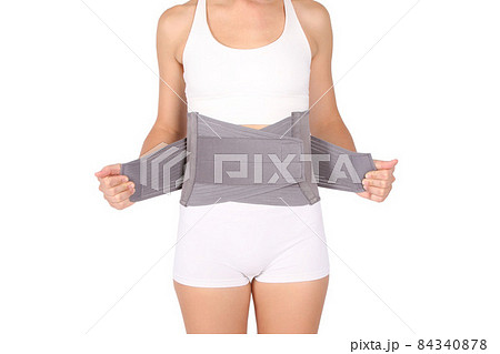 Orthopedic lumbar corset on the human body. Back brace, waist support belt for back. Posture Corrector For Back Clavicle Spine. Post-operative Hernia Pregnant and Postnatal Lumbar brace after surgery. 84340878