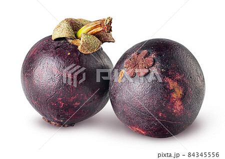 Two ripe mangosteen isolated on a white 84345556