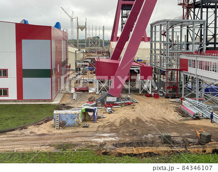Industrial construction of a large factory with equipment and metal structures Industrial construction of a large factory with equipment and metal structures 84346107