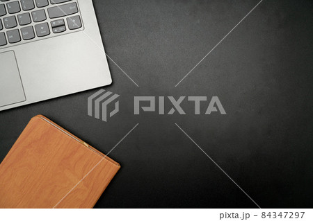 Office Supplies Over Desk With Keyboard And Glasses And Coffee Cup For Working Remotely, Assorted School Utilities For Studying With Hot Drink And Eyeglasses. 84347297