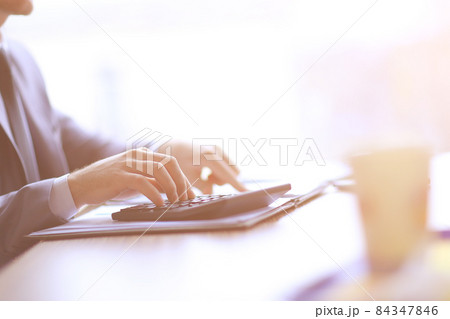 close up. businessman makes calculations on the calculator close up. businessman makes calculations on the calculator 84347846