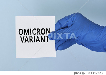 Doctor hand holds a card with text - New covid variant Omicron. Covid-19 new variant - Omicron. Omicron variant of coronavirus. SARS-CoV-2 variant of concern Doctor hand holds a card with text - New covid variant Omicron. Covid-19 new variant - Omicron. Omicron variant of coronavirus. SARS-CoV-2 variant of concern 84347847