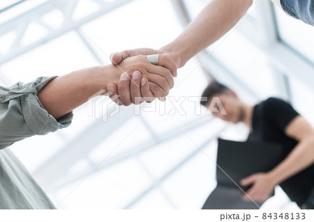 close up. business handshake over blurry background close up. business handshake over blurry background 84348133