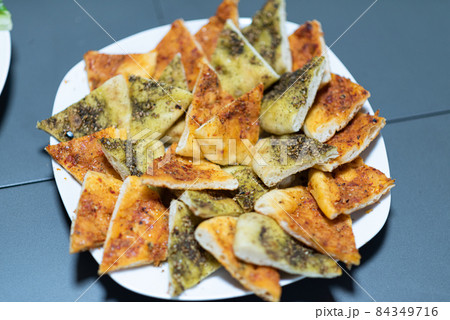 Arabic traditional food Manakish with Zaatar. Pita zatar Arabic traditional food Manakish with Zaatar. Pita zatar 84349716
