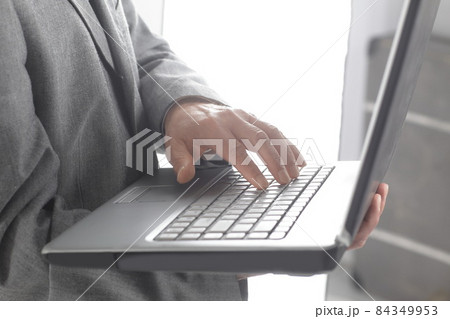 close up.businessman typing on a laptop keyboard.isolated on white background 84349953