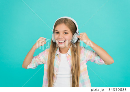For pleasant musical exposure. Little girl child listening For pleasant musical exposure. Little girl child listening 84350883