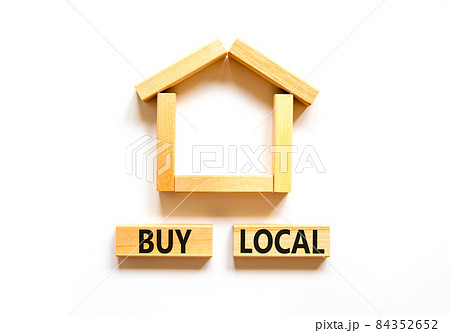 Buy local and house symbol. Concept words 'Buy local' on wooden blocks near miniature house. Beautiful white background, copy space. Business and buy local house concept. 84352652