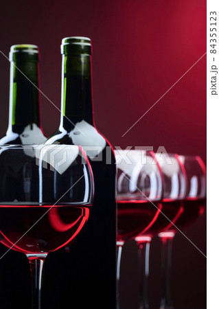 Bottles and glasses of red wine Bottles and glasses of red wine 84355123