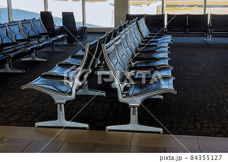 Empty seats in the departure lounge at the airport Empty seats in the departure lounge at the airport 84355127