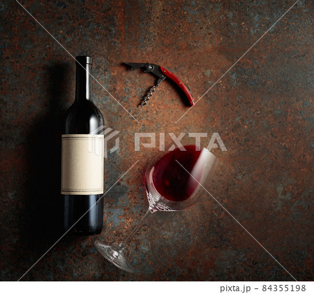 Red wine on an old rough background. Red wine on an old rough background. 84355198