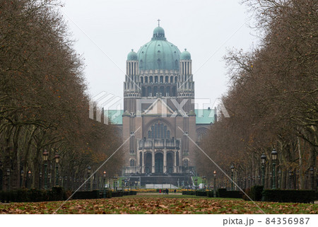 Koekelberg, Brussels Capital Region, Belgium - 11 19 2021: Low angle view of the Basilica of the Sacred Heart and the Elisabeth park in autumn 84356987